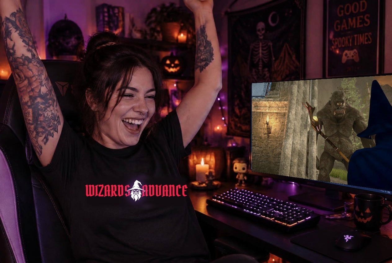 A gamer cheering in front of her PC wearing a Wizards Advance tee